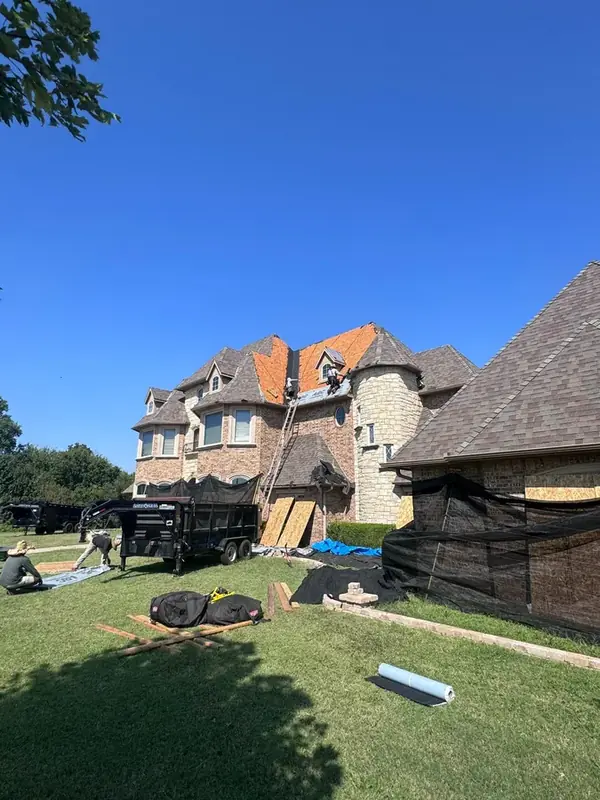 ScottBuilt crew working on luxury estate roof